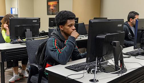 Instructor and students in the computer lab at the EOC