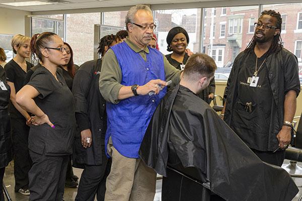 Cosmetology students and a professor in class